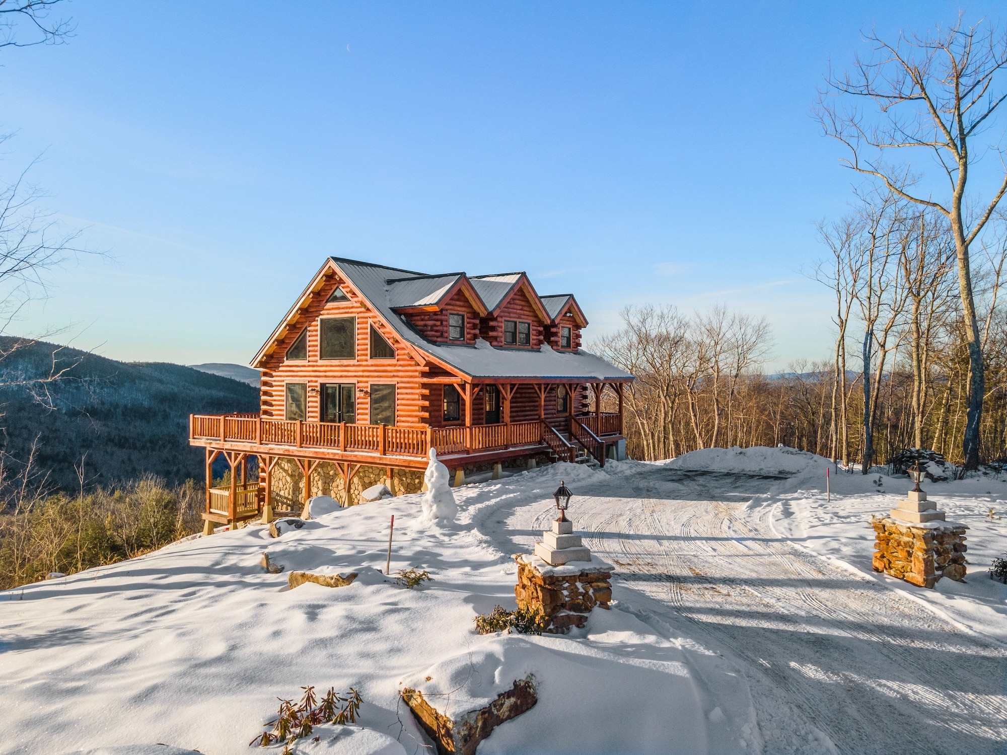 Aerial view of A building facade of wooden log on snow covered mountain perfect for a Home Inspection Pigeon Forge TN